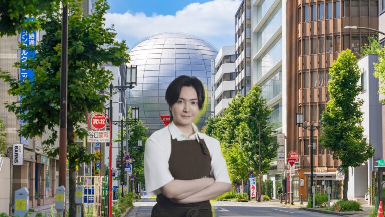 A chef in a brown apron, arms crossed, composited over a Nagoya street scene with a silver spherical museum building