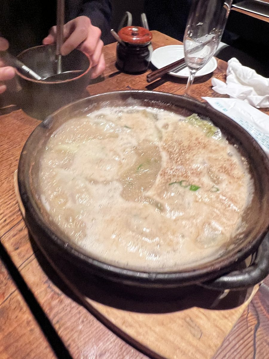 A simmering nabe hot pot at the table