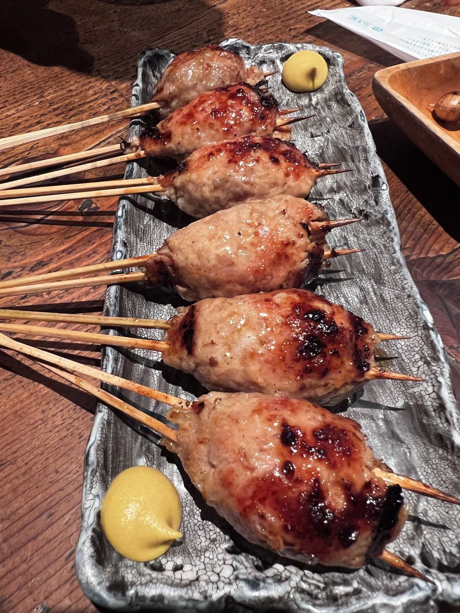 Grilled chicken tsukune skewers served with mustard