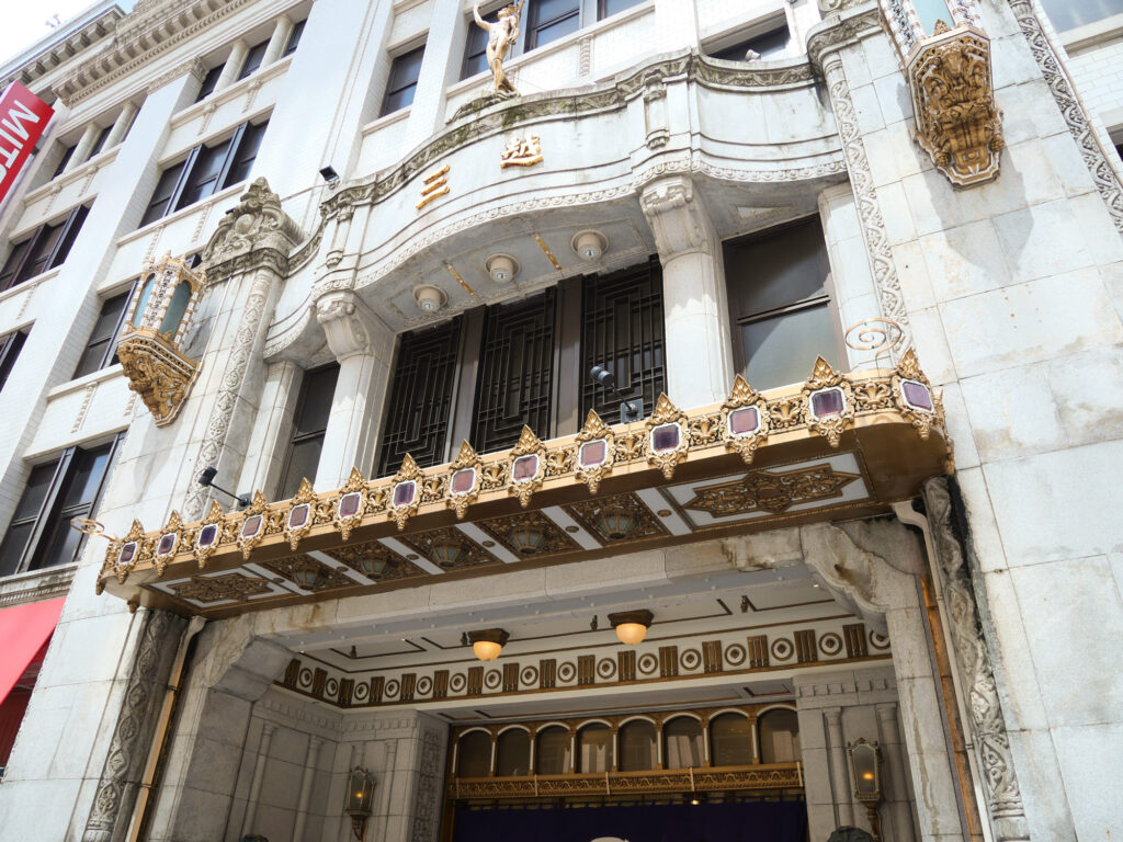 Renaissance stone facade of the Mitsukoshi Nihonbashi store, with an ornate gilded entrance canopy and gold Mitsukoshi sign