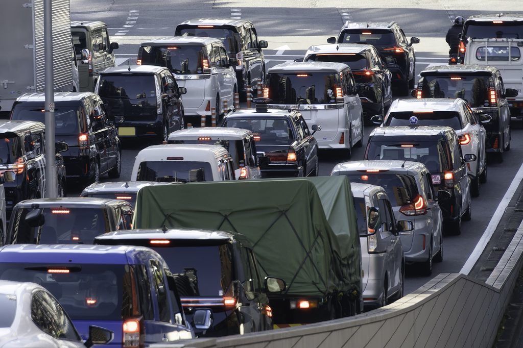 Rows of cars backed up bumper to bumper in a traffic jam